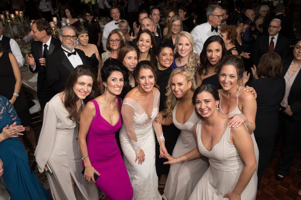 bride at her reception with all her girl friends