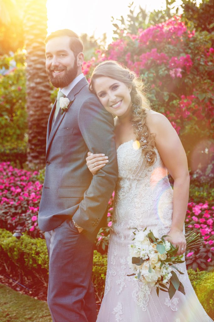 bride holding onto to her groom's arm