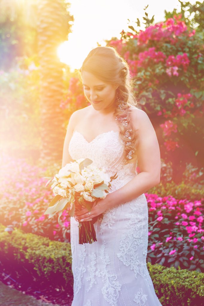 bride looking down at her bouquet