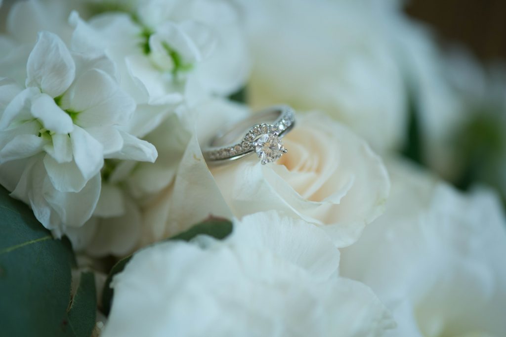 wedding rings on rose bouquet