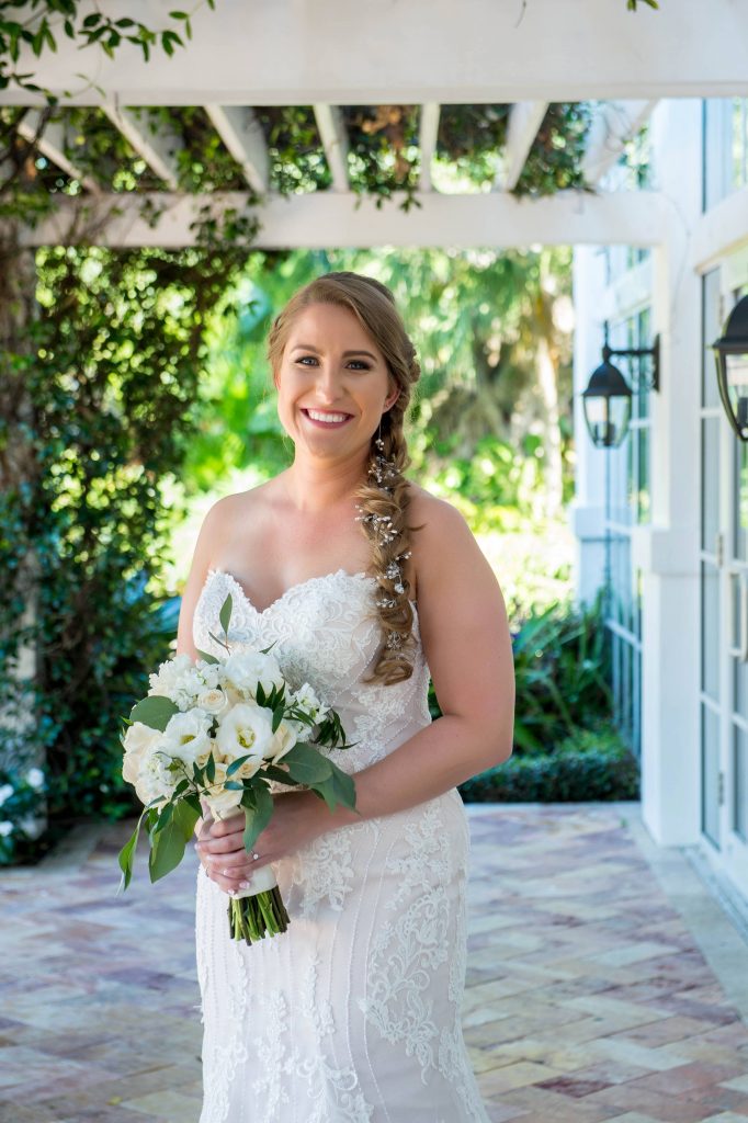 bride holding her bouquet in wedding gown