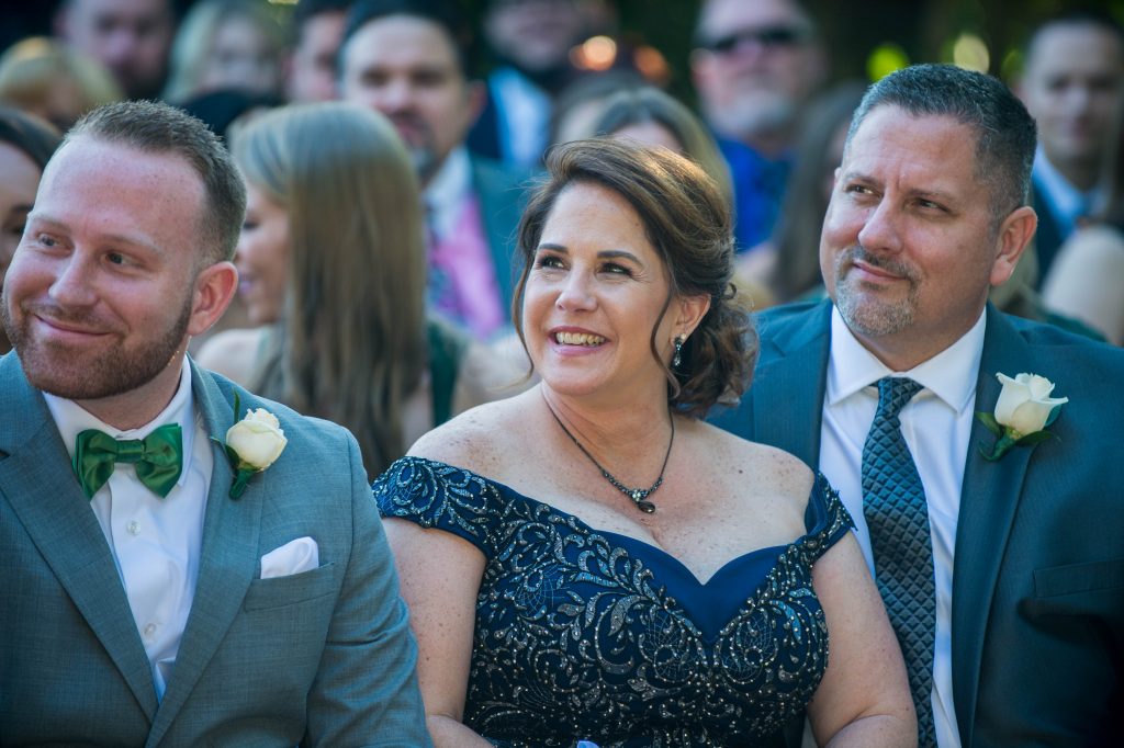 bride mom smiling during wedding ceremony