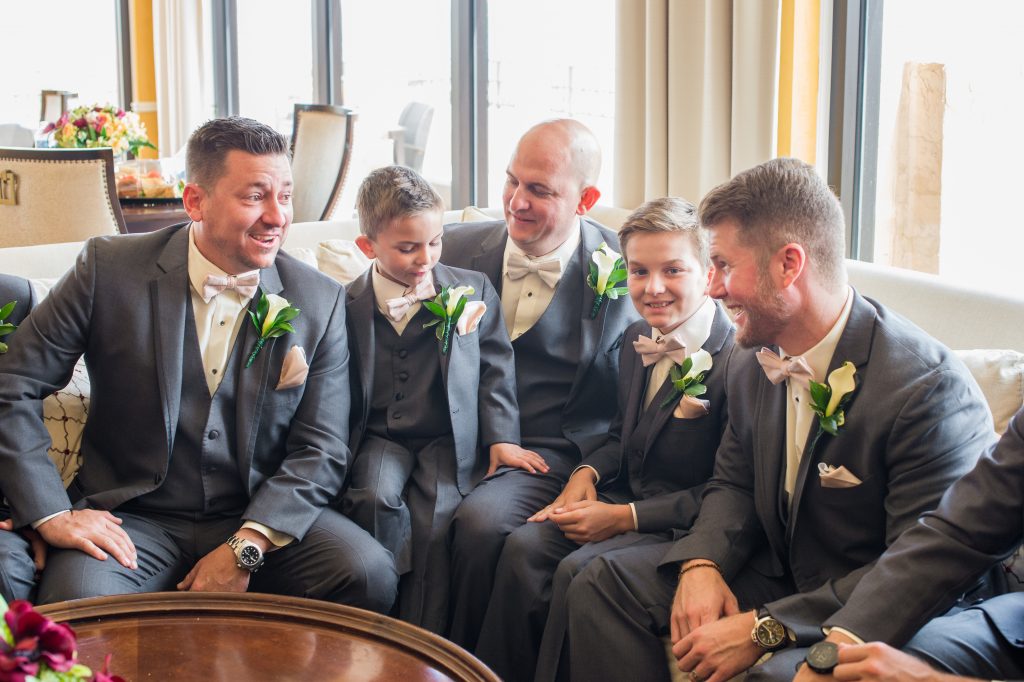 groom in getting ready room with groomsmen