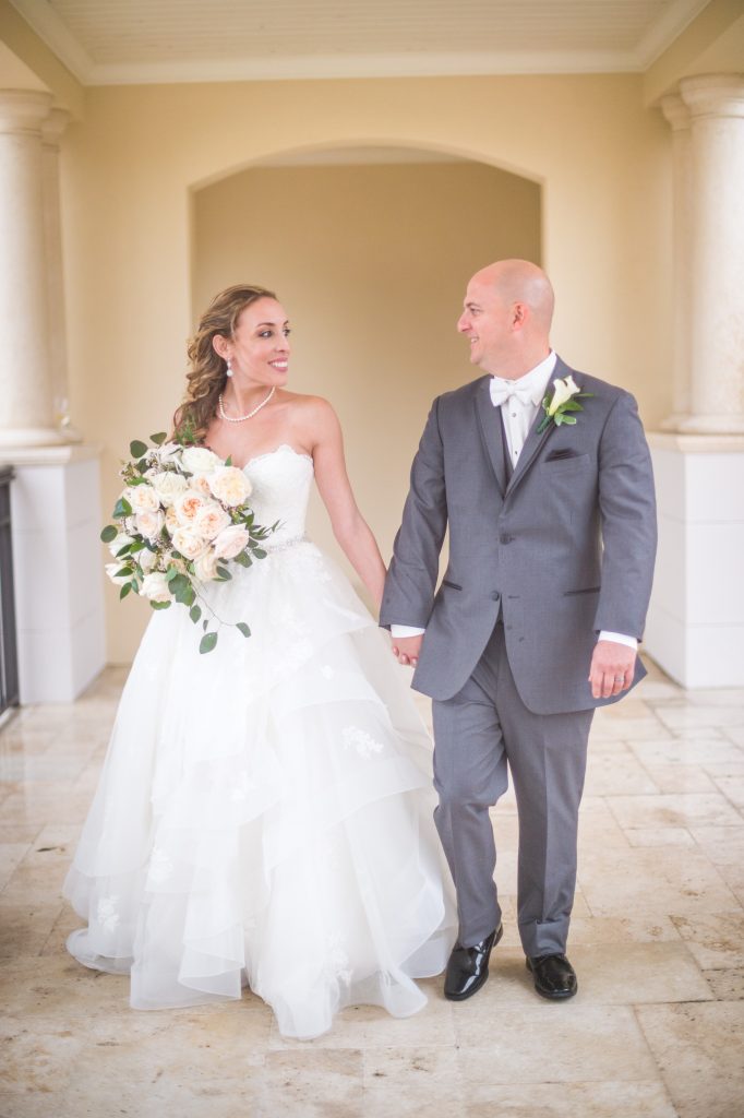 bride and groom walking and laughing together