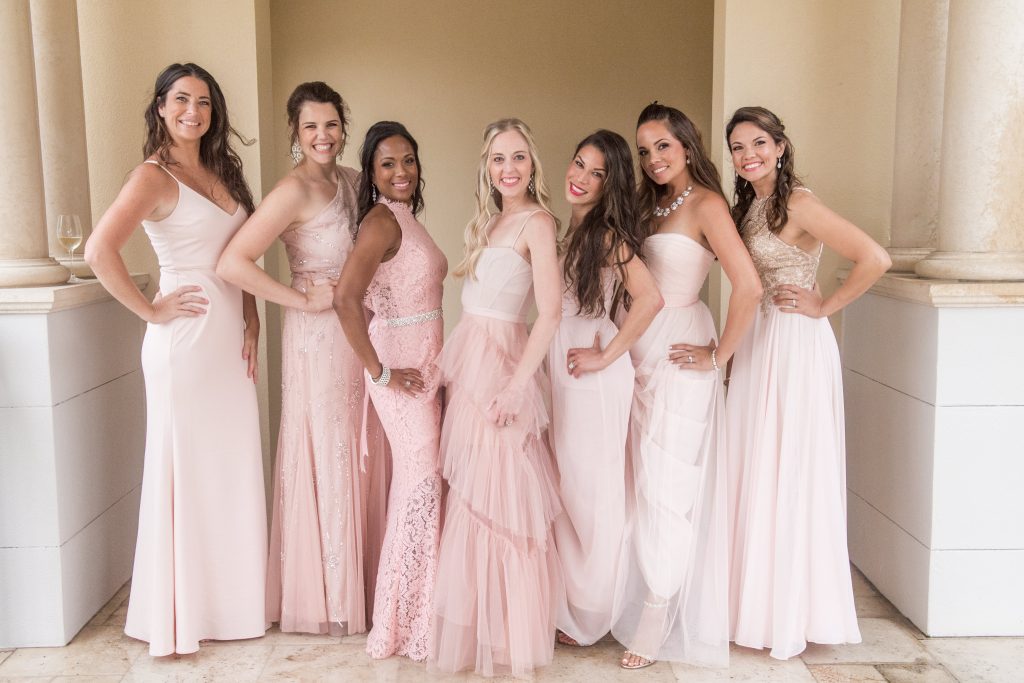 bridesmaids in blush gowns