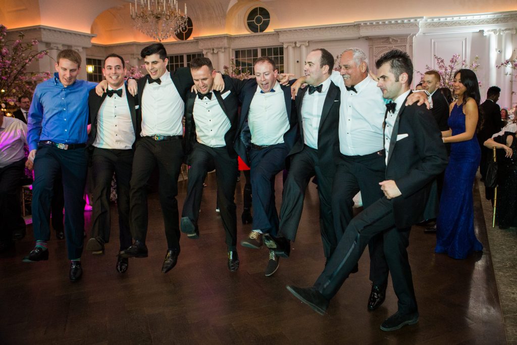 groom dancing with his groomsmen