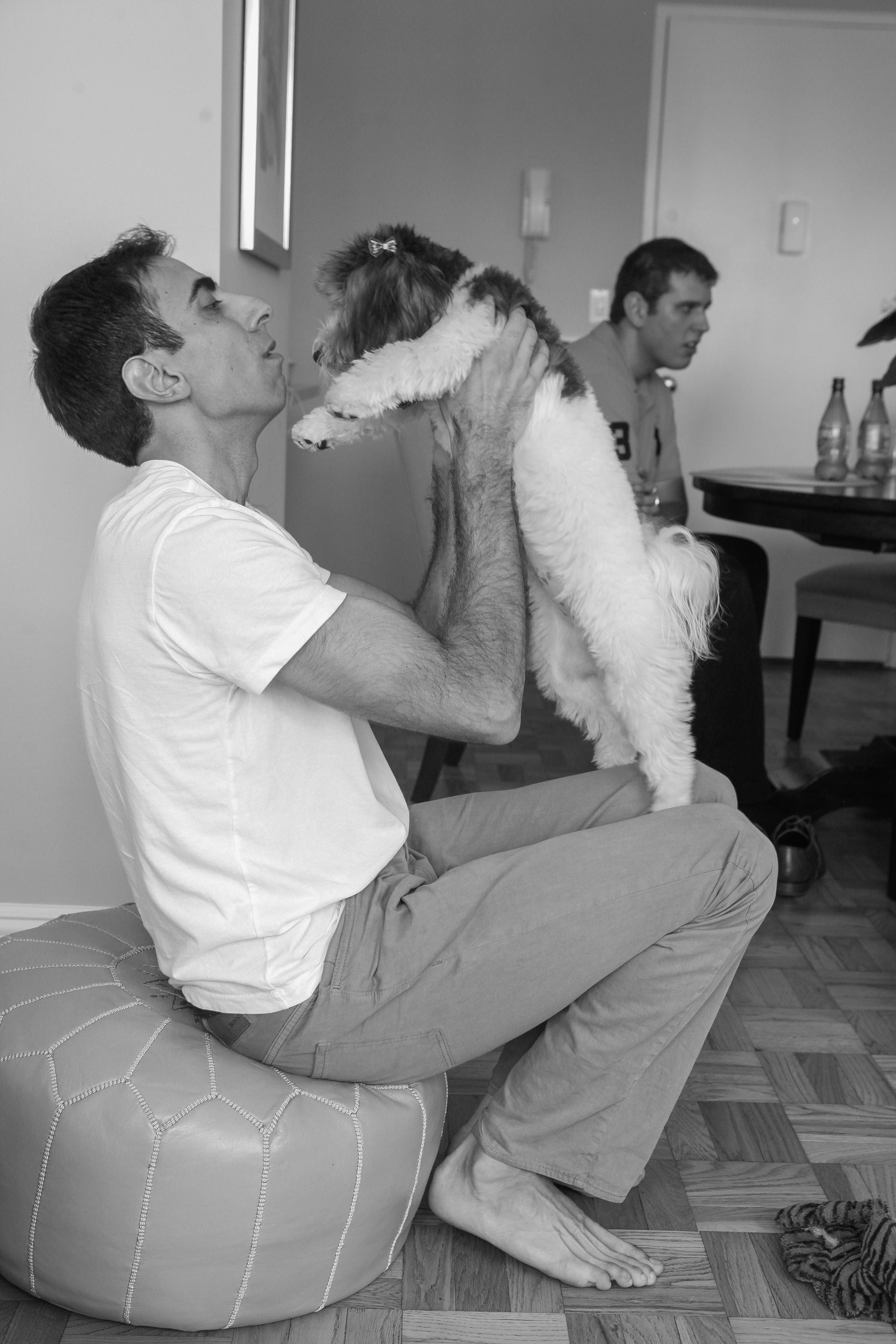Groom kissing his dog
