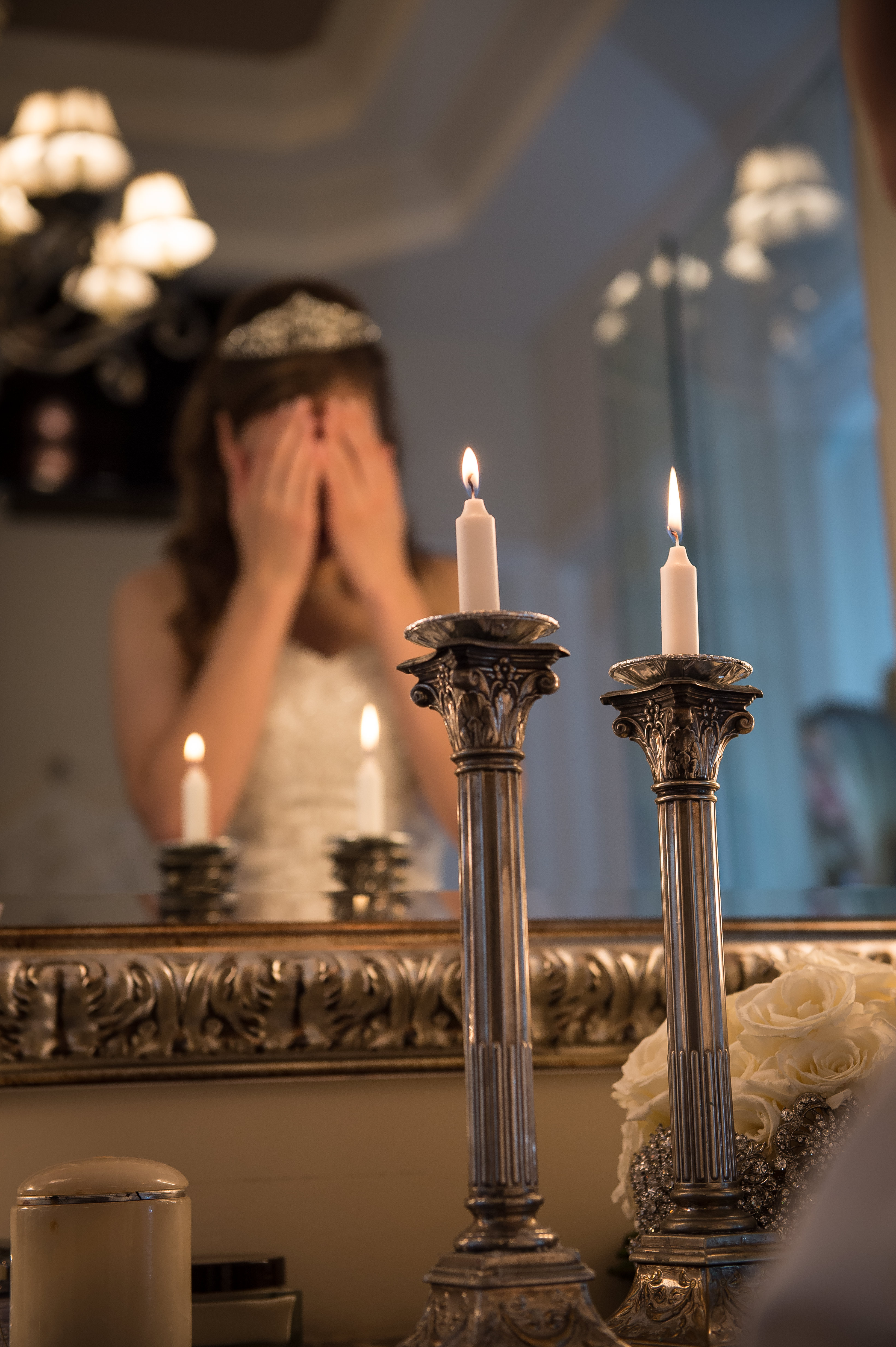 Bride lighting candles