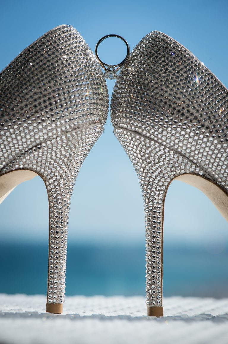Ring between bridal shoes