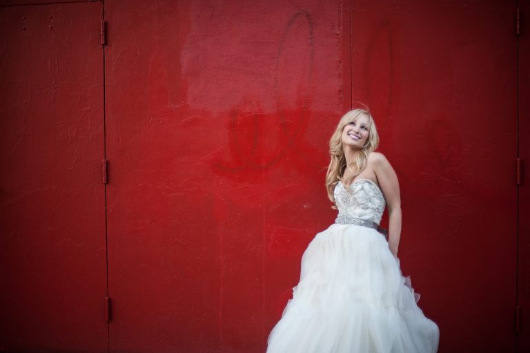 Bride against red wall