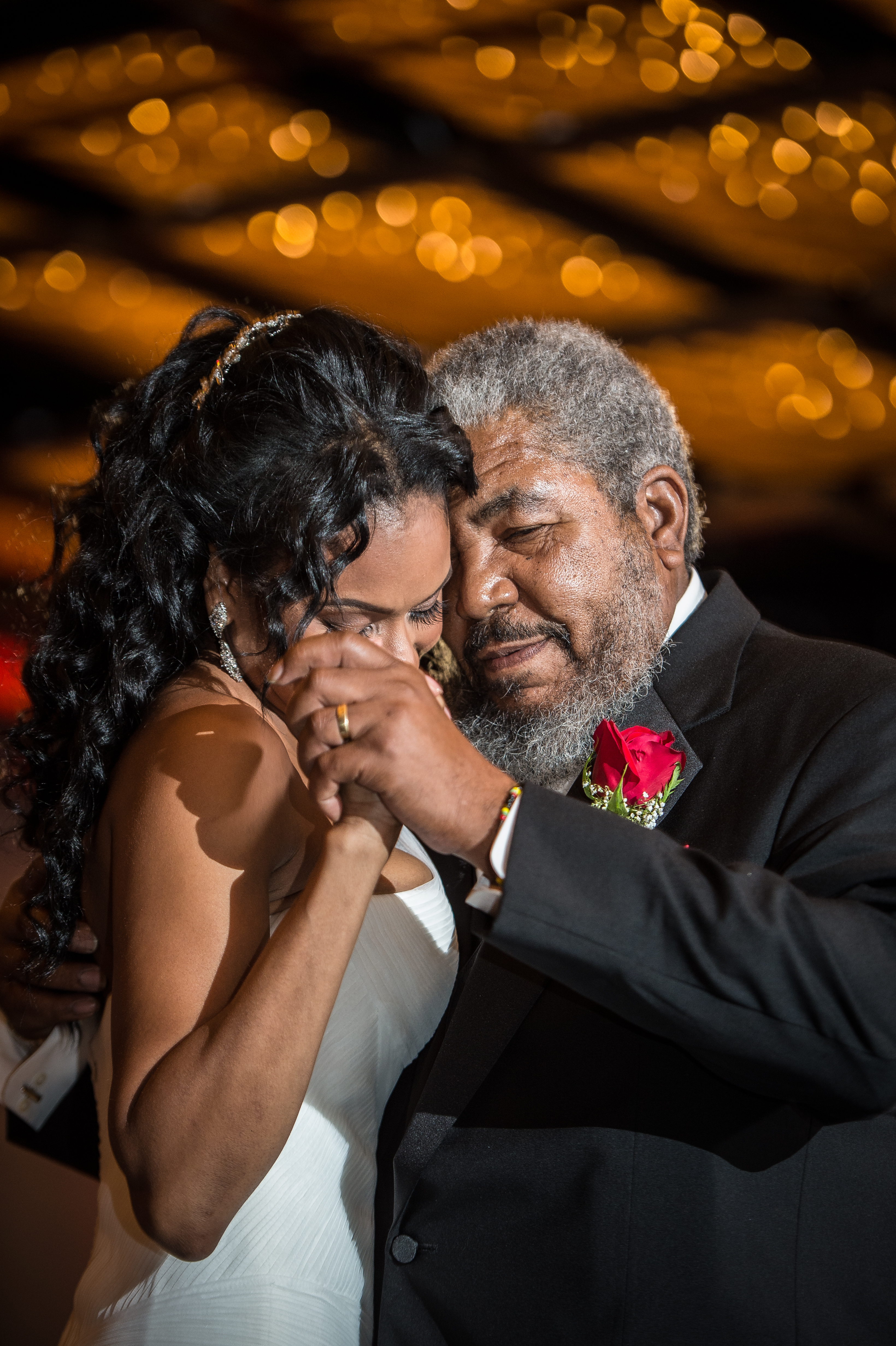 Bride first dance with father holding tight