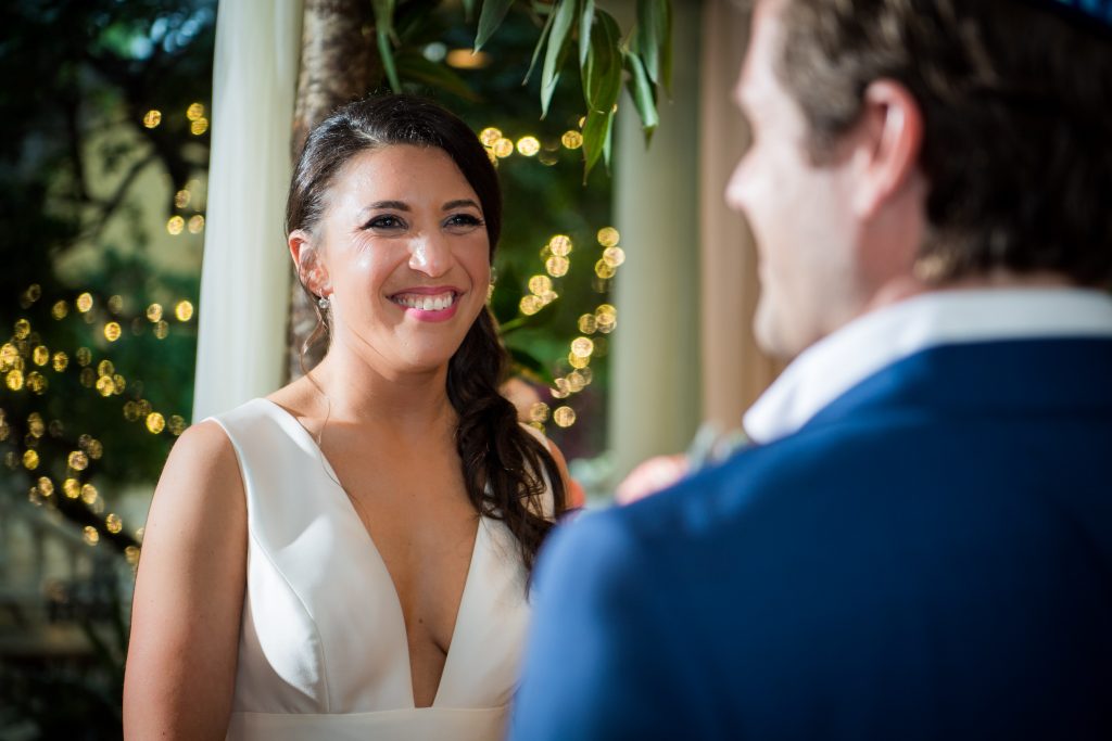 Bride smiling at groom after first look
