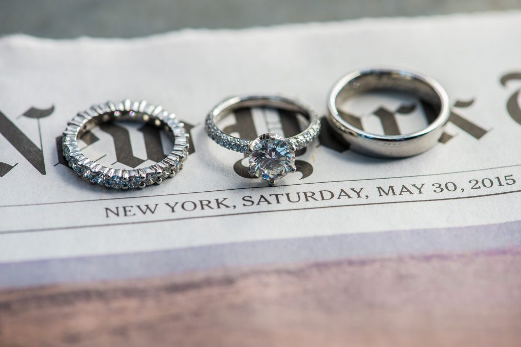 Wedding rings on newspaper